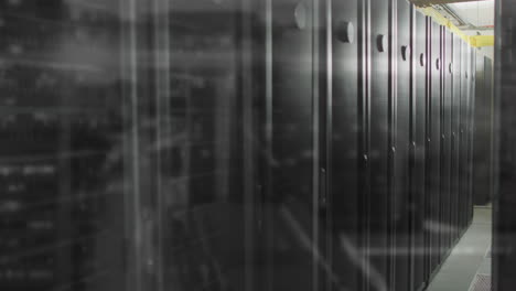 black server racks being rendered receding down corridor, showing overhead cable trays in 3d render
