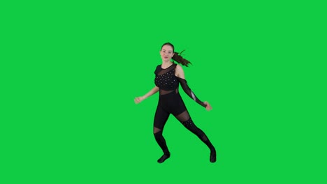 Caucasian-female-dancer-in-black-outfit-performing-in-front-of-the-green-screen-alone-in-slow-motion