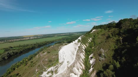 aerial view of a white cliff and valley