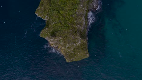 Aerial-Above-Castro-Ballota-Island-Deep-Blue-Waters-And-Seagulls