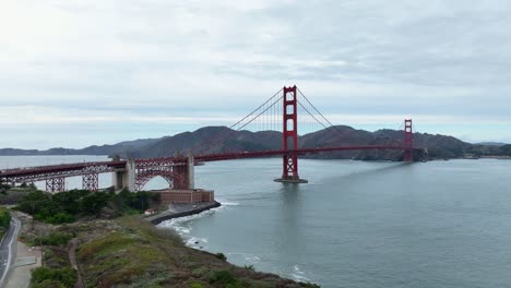 aerial view toward golden gate bridge across san francisco bay on overcast day
