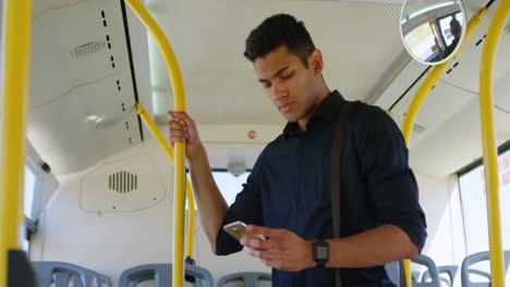 male commuter using mobile phone while travelling in bus 4k