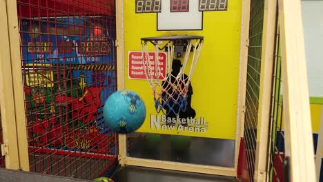 colorful basketball balls thrown into baskets in a vibrant park game, capturing the joy of skill and aim, fun at the arcade