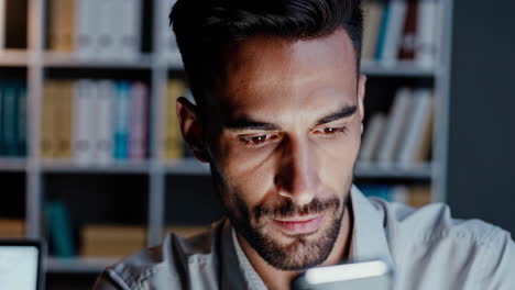 man using phone in office