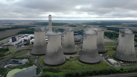 aerial view over ratcliffe-on-soar power station smokestack emitting steam on nottingham countryside