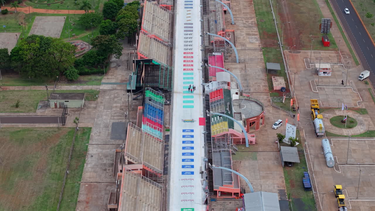 Aerial tops down Sambadrome of Encarnacion, Paraguay, vehicles traffic at city venue