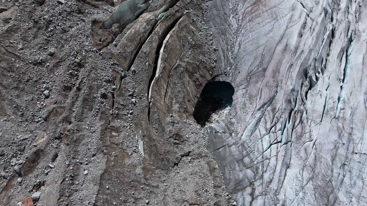 Aerial view of Morteratsch Glacier showing icy crevasses and rugged terrain