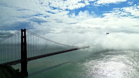 golden gate bridge shrouded in billowing fog in san francisco, california, usa