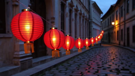 red lanterns illuminate a city alley at night