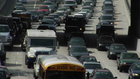 fast zoom into traffic crawling along a los angeles freeway