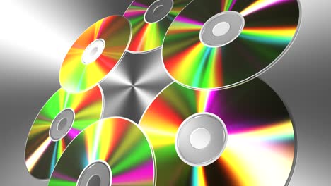 discos de cd-dvd giratorios sobre fondo metálico. 4k. 3840x2160. con bucle sin costuras.