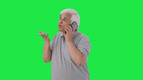 Angry-Indian-old-man-shouting-on-call-Green-screen