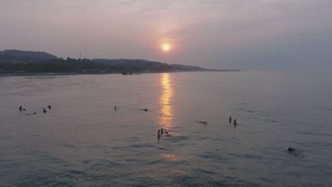 Aerial-Drone-view-of-La-Bocana-Surfers-El-Tunco-El-Salvador-at-Sunrise