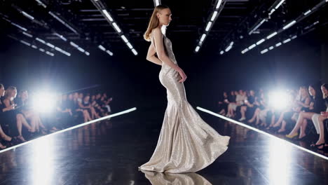 elegant model in a sparkling gown on a fashion runway