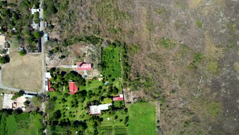 aerial drone shot of green grass hacienda ake in yucatan