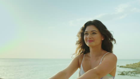 Young-Woman-Leads-Behind-Herself-Portrait-Goes-Along-The-Beach-Smiles-Hair-Croaks-In-The-Wind-Pov-Vi