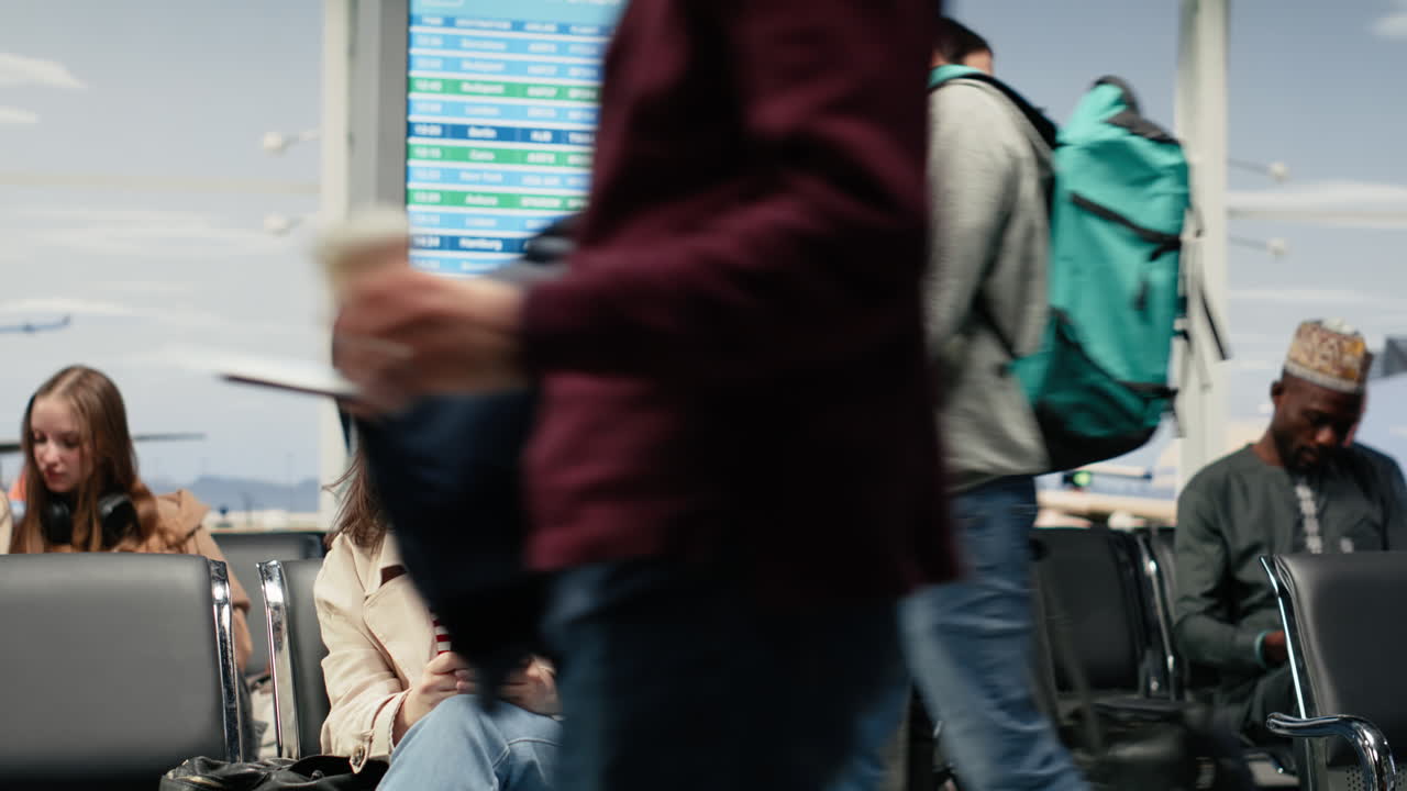 Woman in airport checking flight itinerary on smartphone, sitting on bench