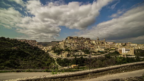 view of ragusa, sicilian city, italy with white clouds movement in timelapse on a cloudy day