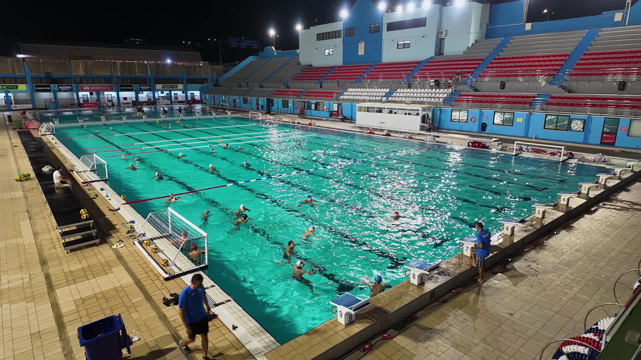 Friendly water polo match of the Sliema ASC team as part of the night training session in the National Pool Complex of Malta.