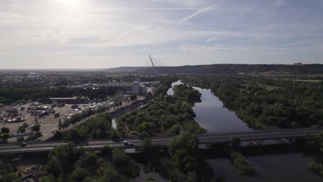 Aerial-Flying-Over-Puente-del-Príncipe-Felipe-Bridge-Road-Crossing-River-Tagus-With-View-Of-Castilla-La-Mancha-Bridge-In-The-Background