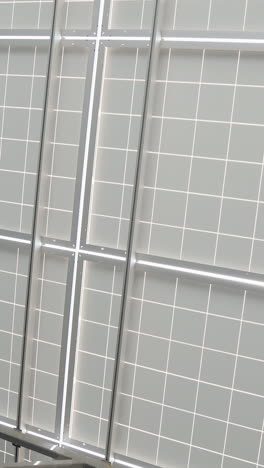 back side view photovoltaics solar panels in solar power station alternative energy from the sun. vertical video