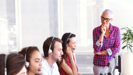 customer service trainer monitoring her team