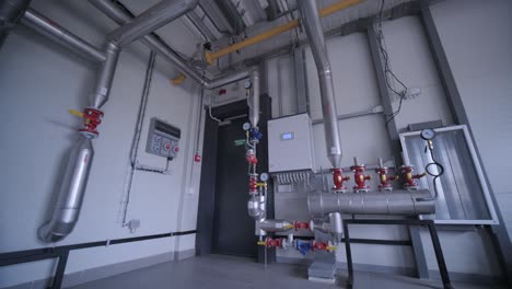 modern industrial gas boiler room equipped for heating process. heating gas boilers, pipelines, valves.