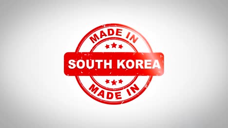 made in south korea signed stamping text wooden stamp animation. red ink on clean white paper surface background with green matte background included.