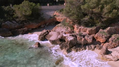 discover the captivating landscapes of cala rajada in mallorca. experience the tranquil waters, rocky shoreline, and lush greenery that surround this beautiful destination.