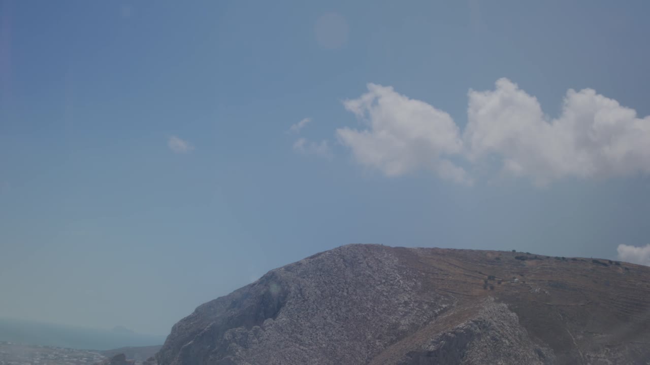 View of Santorini islands from above through chromatic airplane window with wind turbulance, Santorini, Greece, Europe