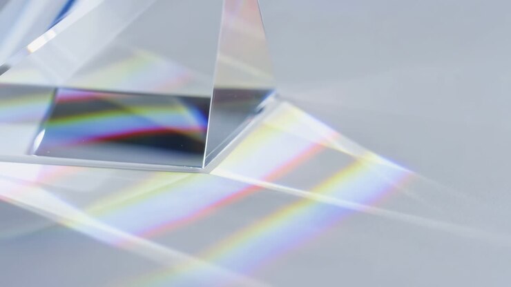 Crystal Prism Casting Soft Rainbow Refractions Across Smooth White Surface, Closeup Macro Shot, Subtle