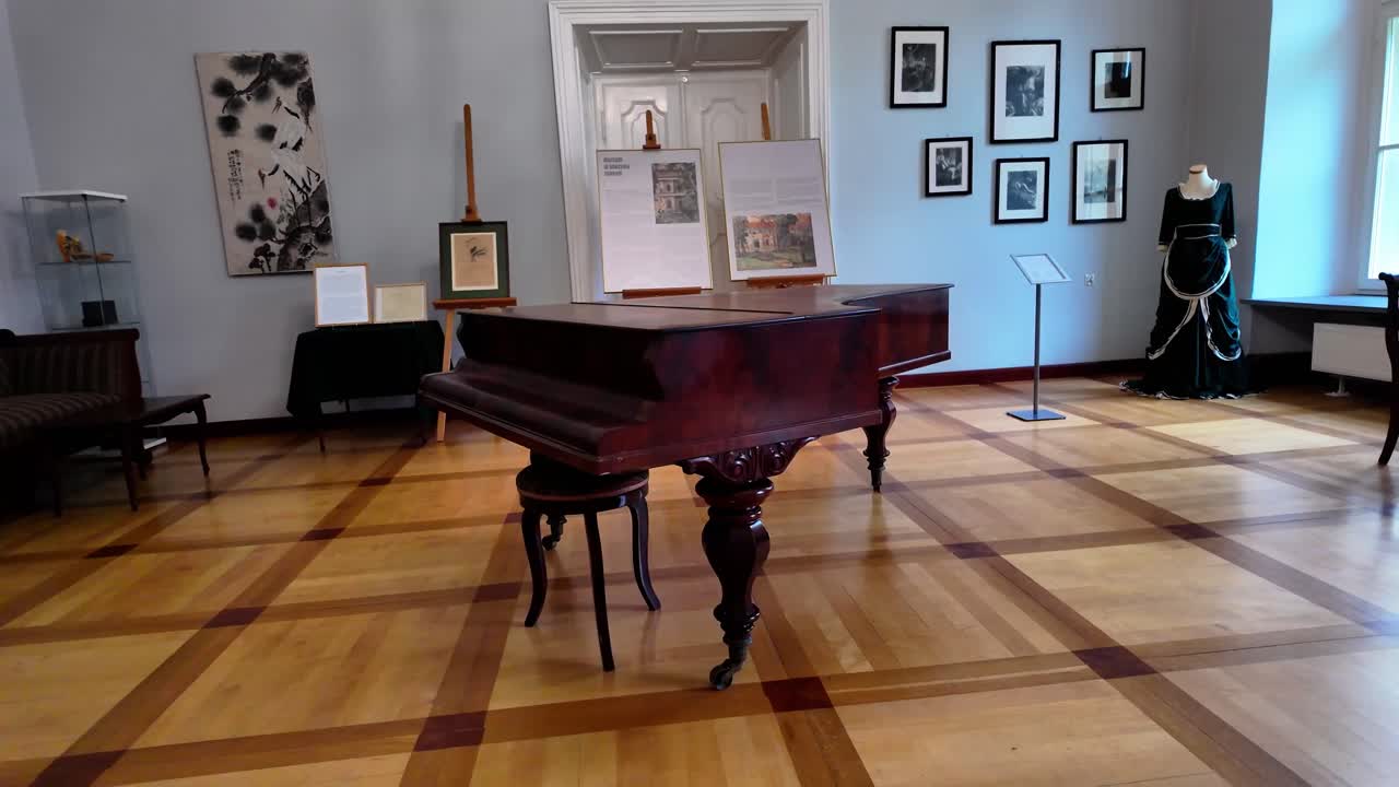 Old classical wooden piano standing in museum - 4K