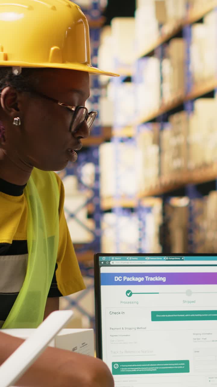 Vertical Video Black logistics workers team handling cargo tracking on pc software
