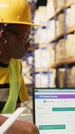 vertical video black logistics workers team handling cargo tracking on pc software