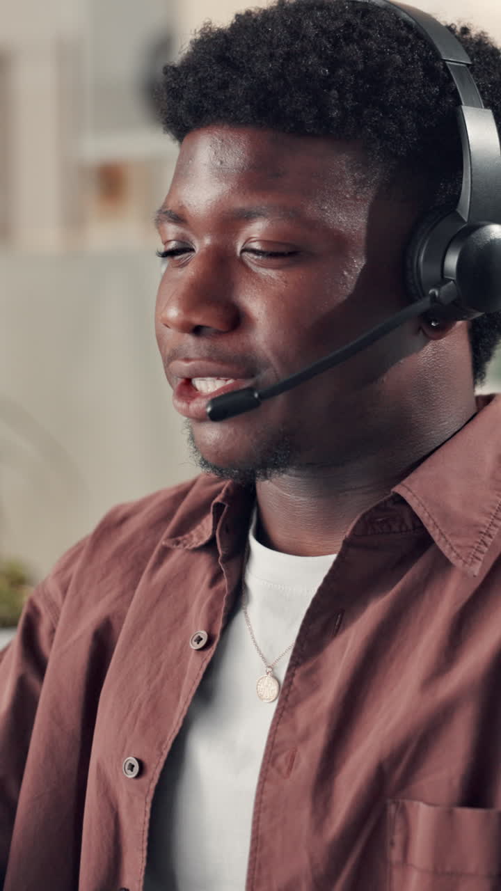 Young Black Man Speaking on Headset with Microphone