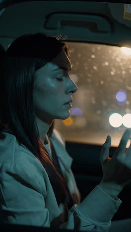 woman driving at night in the rain