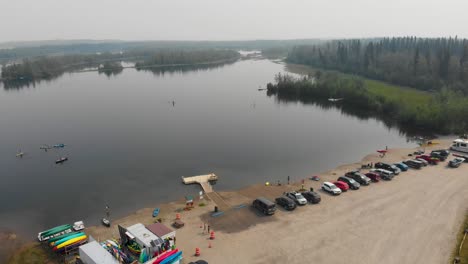 4k drone video of paddle boarders and kayakers on cushman lake in fairbanks, ak during summer day-6