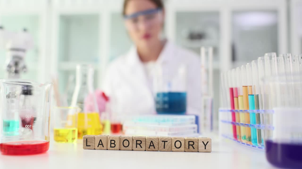 Scientist conducting experiments in a laboratory with colorful liquids and equipment
