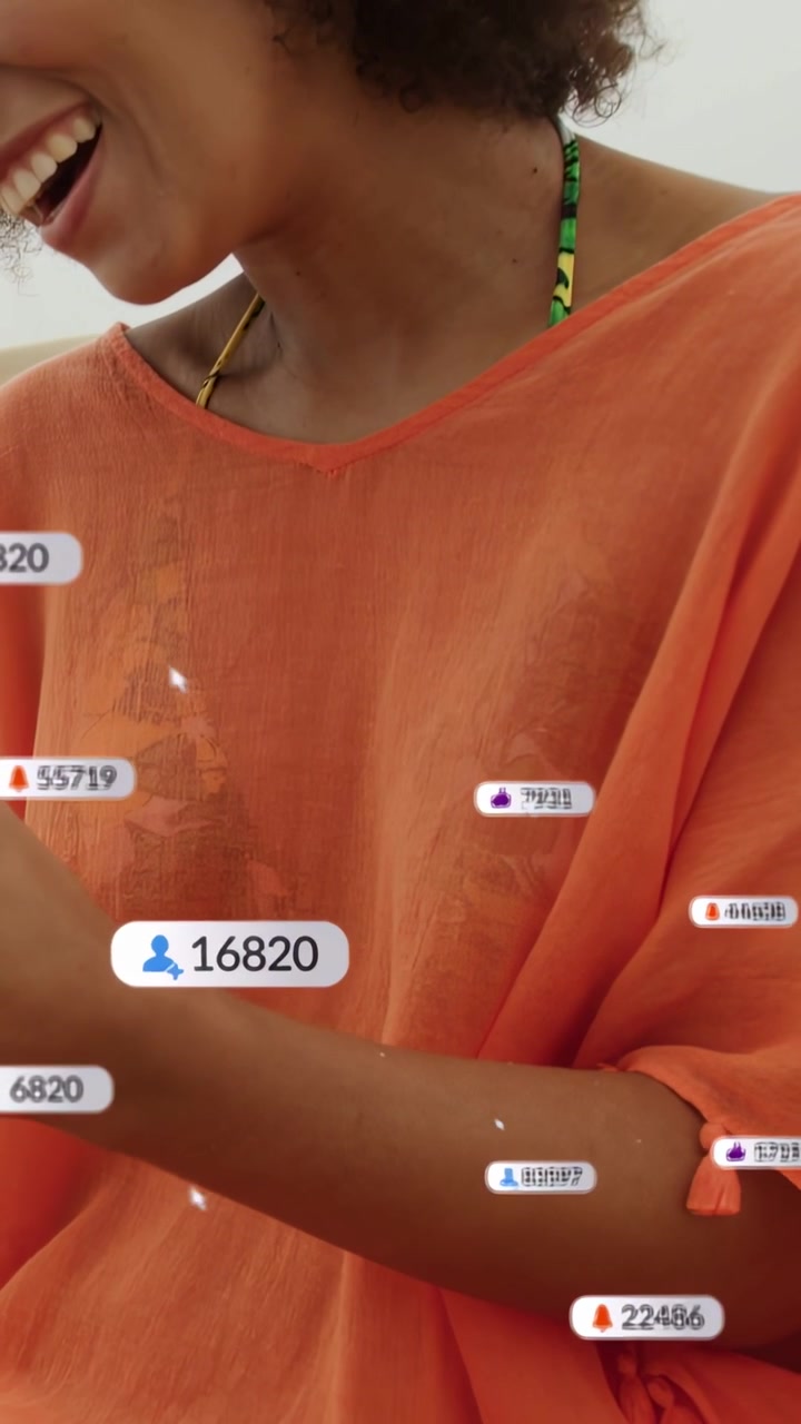 Vertical video: Woman tapping phone checking marketing feed, making alerts on lap as camera rising