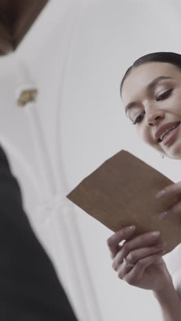 woman reading a vintage letter in a church