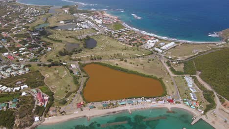 aerial view overlooking the city of basseterre, in sunny saint kitts and nevis - pan, drone shot