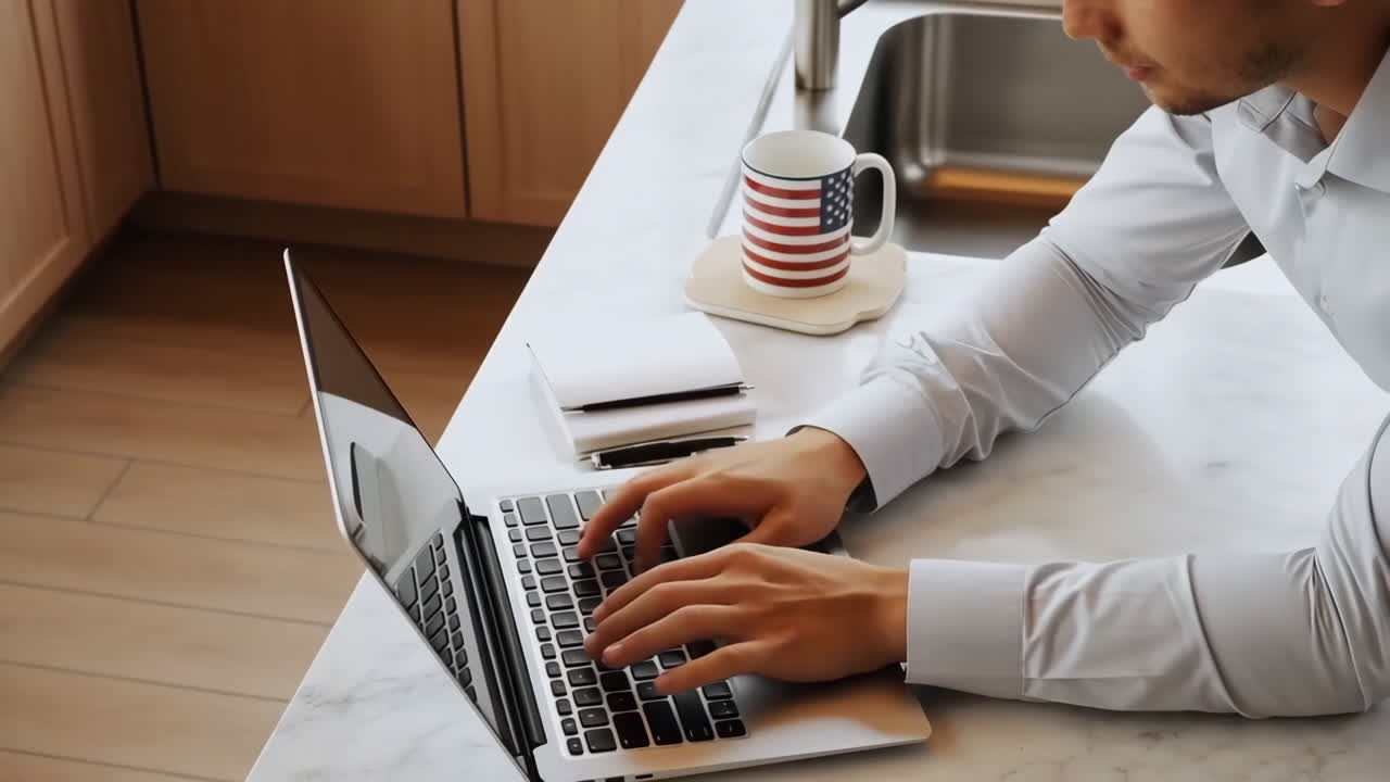 Working on a laptop in the kitchen
