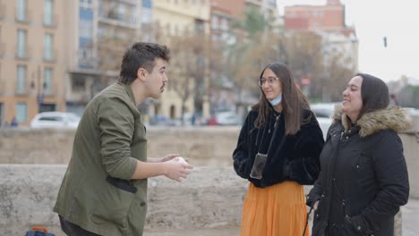 people interacting on a city street
