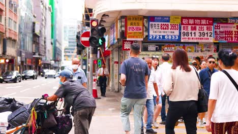 pedestrians crossing a bustling city street