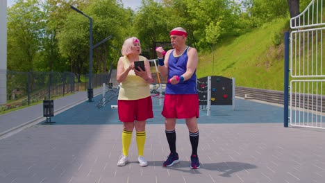 senior couple working out together outdoors