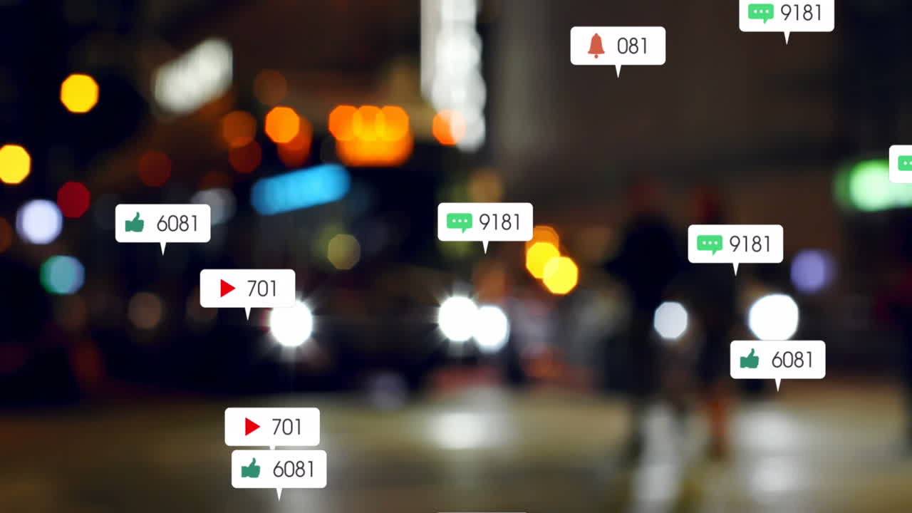 Animation of social media icons and numbers over out of focus traffic light