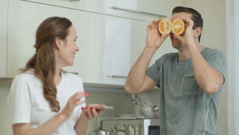 Closeup-happy-couple-having-fun-at-breakfast.-Smiling-woman-taking-photo.