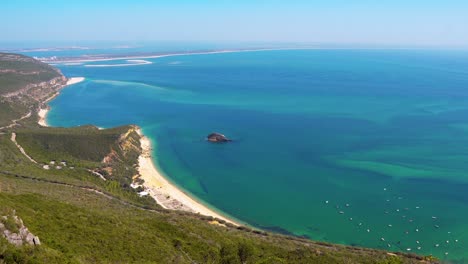 gorgeous panoramic view of the green landscape and blue atlantic ocean from portinho da arrábida, portugal