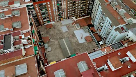 Aerial-drone-shot-of-a-high-rise-apartment-block-in-Barcelona-city