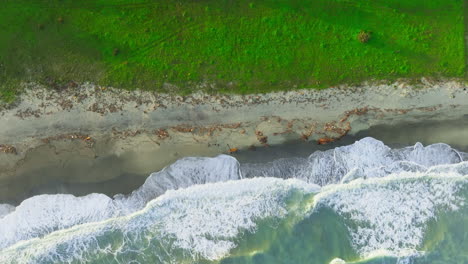 rough sicilian sea with beach nature background overhead vertical relaxing